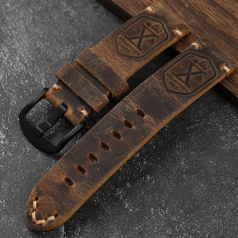 brown genuine leather watch strap accessory with black clasp with engravings